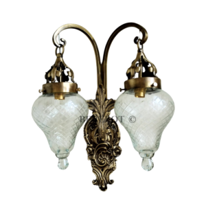 Antique reproduction brass double-arm wall sconce with cut glass shades