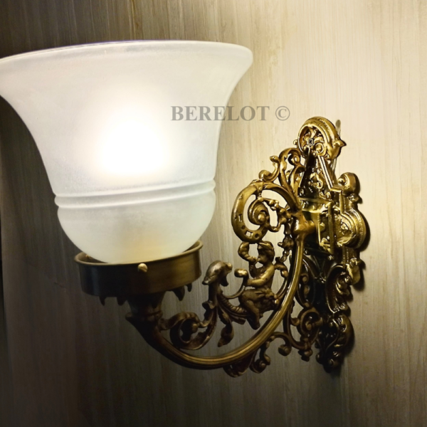 Pair of antique brass Victorian wall sconces with frosted glass shades