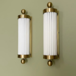 Pair of 1940s-style Art Deco brass wall sconces with milk glass rods