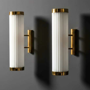 Pair of Art Deco brass wall sconces with milk glass tubes