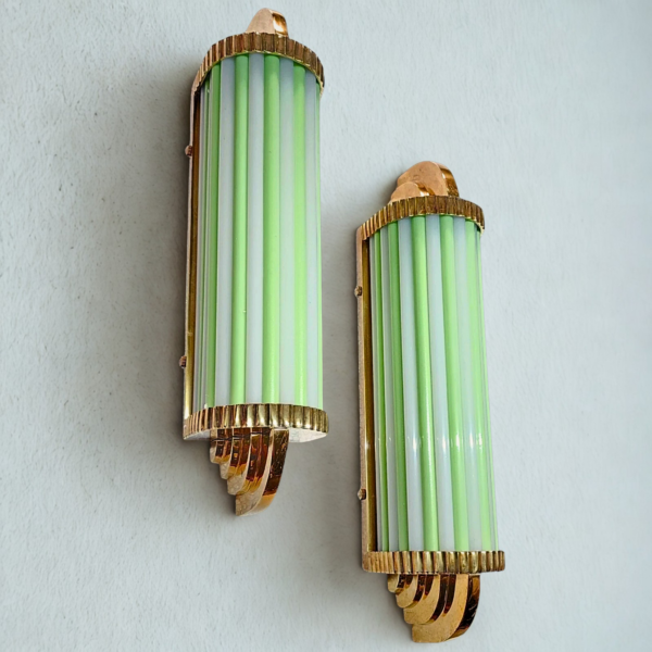 Pair of Art Deco brass wall sconces with green and milk glass rods