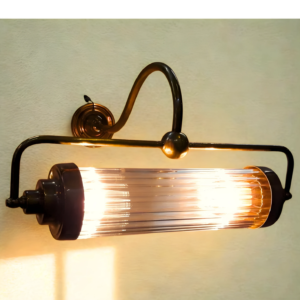 1940s-style Art Deco brass swing-arm wall sconce with clear glass