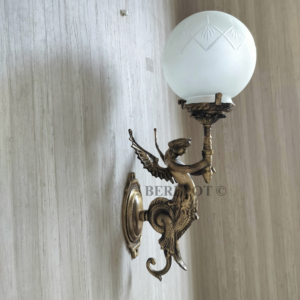 Pair of antique reproduction brass figurine sconces with etched frosted glass globes