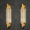 Pair of Art Deco brass wall sconces with clear and milk glass rods