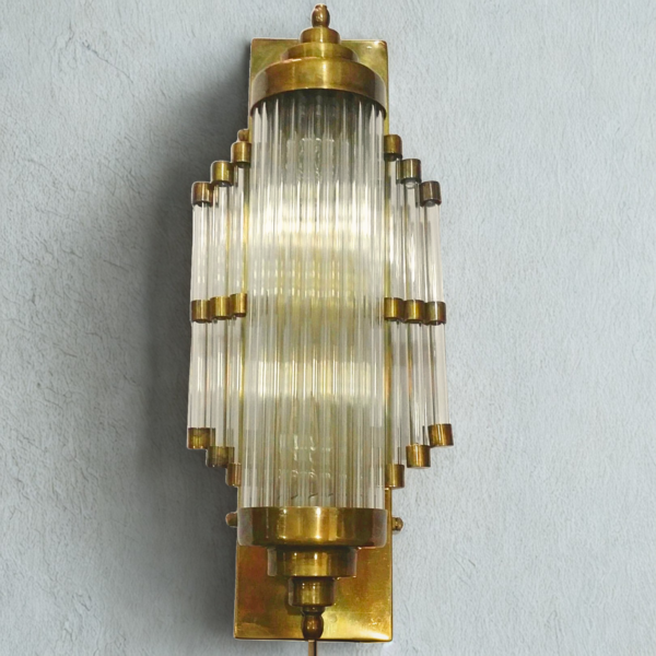 Art Deco tiered clear glass rod wall sconce in brass
